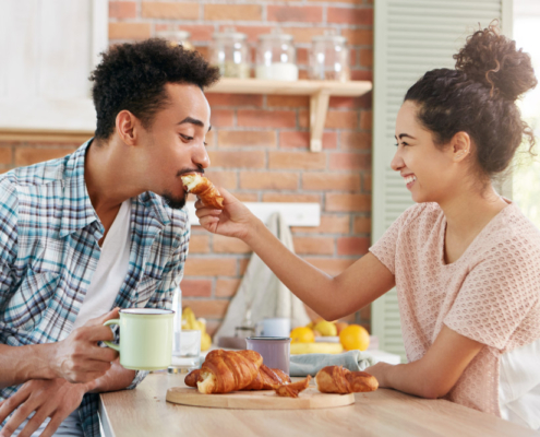 Woman feeding man