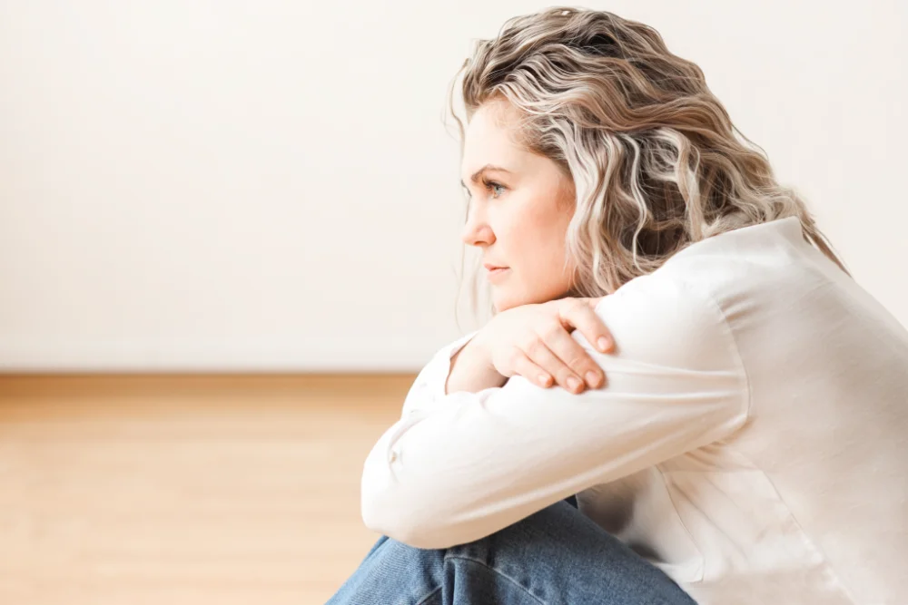 thoughtful woman feeling shame